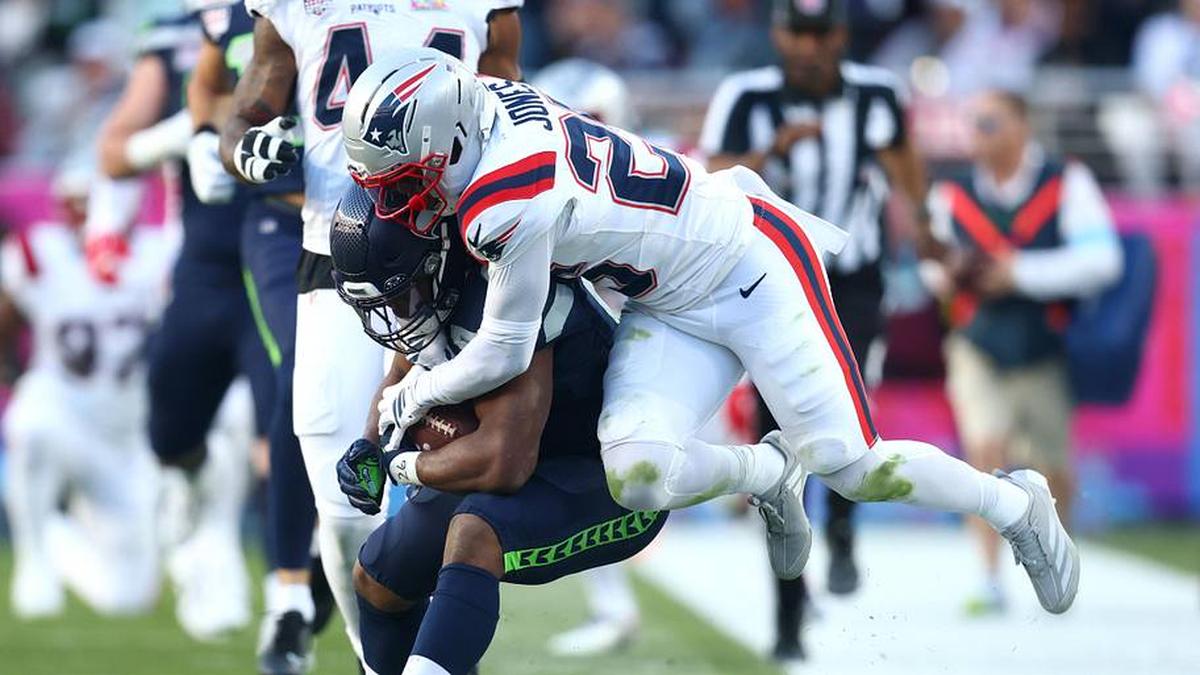  Feb 8, 2026; Santa Clara, CA, USA; New England Patriots cornerback Marcus Jones (25) tackles Seattle Seahawks running back Kenneth Walker III (9) during the second quarter in Super Bowl LX at Levi's Stadium. Mandatory Credit: Mark J. Rebilas-Imagn Images | Mark J. Rebilas-Imagn Images 