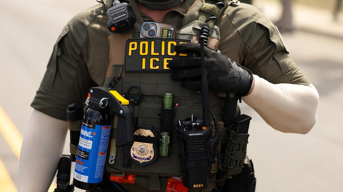 An Immigration and Customs Enforcement agent stands guard as protestors gather at Delaney Hall, which is being used as an ICE detention center in Newark, N.J., on Tuesday, May 26, 2026. According to U.S. media reports, demonstrators clashed with federal agents over the holiday weekend over alleged poor living conditions inside the detention facility. (Charly Triballeau/AFP/Getty Images/TNS)