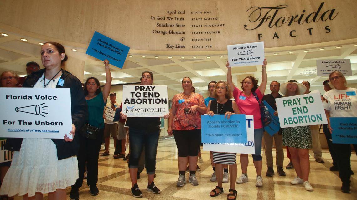 Supporters of Florida Voice For The Unborn demonstrate outside the fourth floor as legislators work on property insurance bills Tuesday, May 24, 2022, at the Capitol in Tallahassee, Fla.