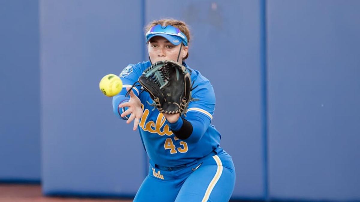  May 31, 2025; Oklahoma City, OK, USA; UCLA Bruins utility Megan Grant (43) catches the ball for an out in the sixth inning against the Texas Tech Red Raiders during the NCAA Softball Women's College World Series at Devon Park. Mandatory Credit: Brett Rojo-Imagn Images | Brett Rojo-Imagn Images 