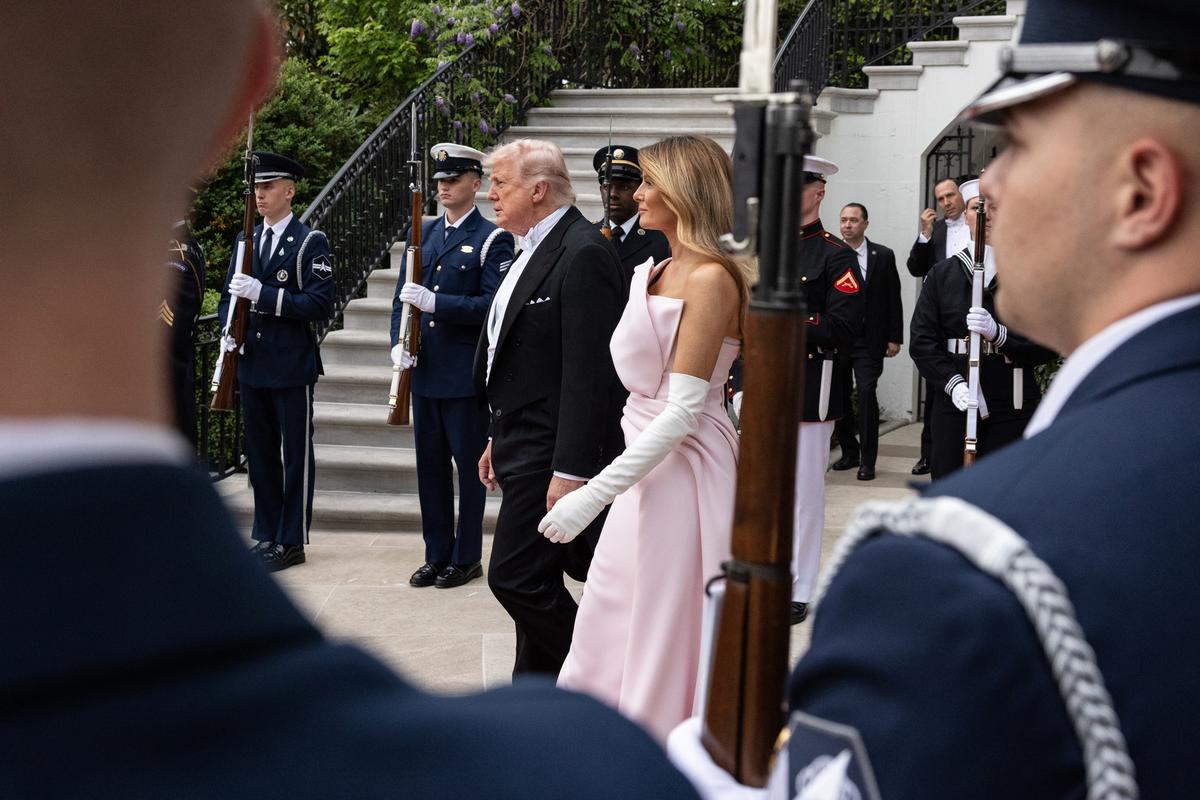 President Donald Trump and first lady Melania Trump walk to greet King Charles III and Queen Camilla of the United Kingdom as they arrive for a state dinner at the White House in Washington, on Tuesday, April 28, 2026. (Anna Rose Layden/The New York Times)
