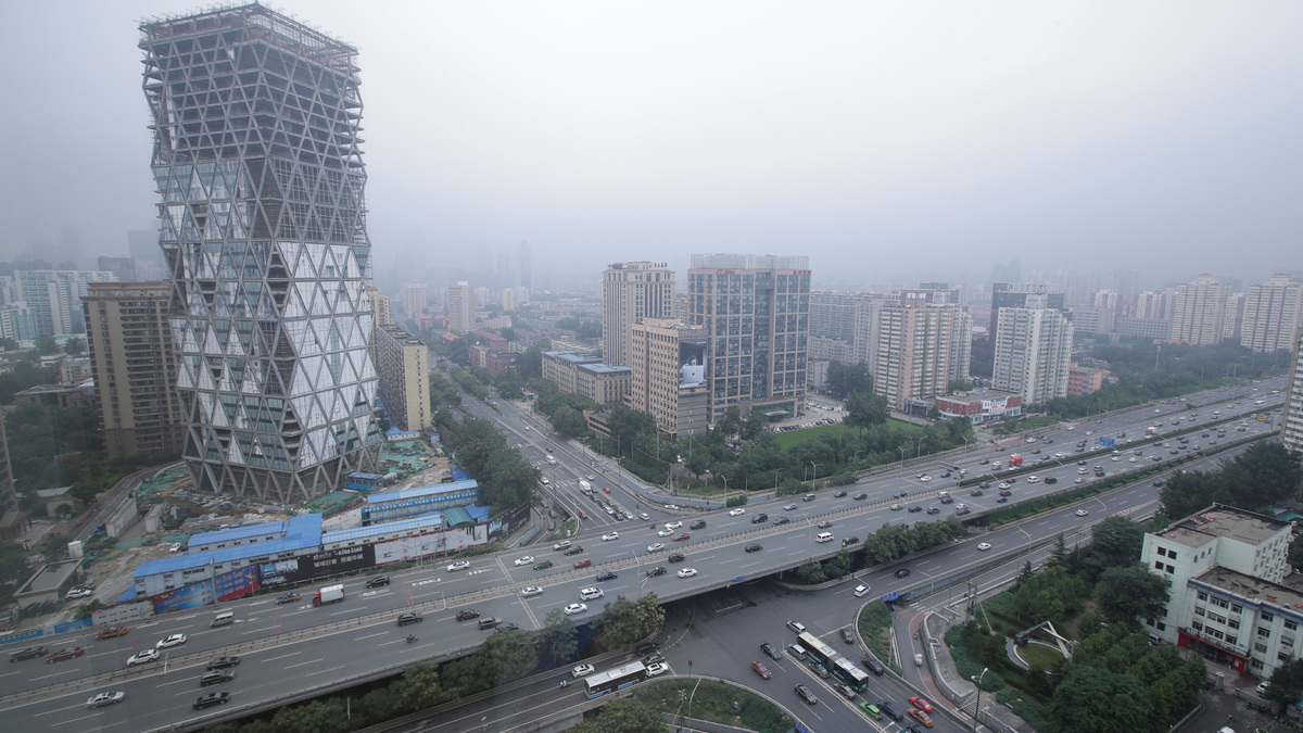 An uncompleted building is seen next to the Fourth Ring Road in Beijing, China July 16, 2018. REUTERS/Jason Lee