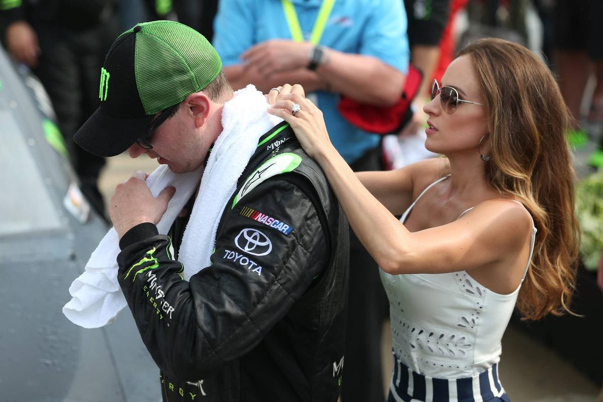  INDIANAPOLIS, IN - JULY 25: Kyle Busch, driver of the #54 Monster Energy Toyota, is assisted by his wife Samantha as he tries to cool off following the NASCAR XFINITY Series Lilly Diabetes 250 at Indianapolis Motor Speedway on July 25, 2015 in Indianapolis, Indiana. (Photo by Brian Lawdermilk/Getty Images) 