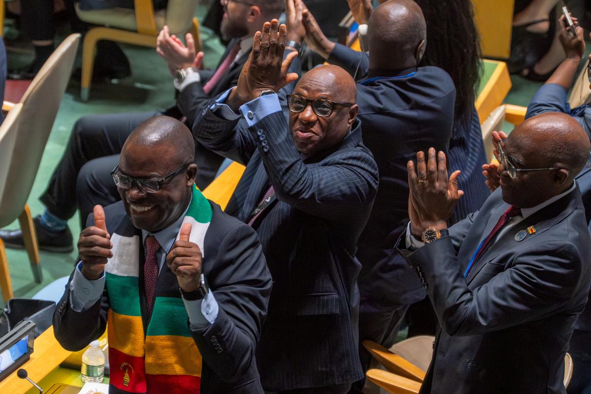 Zimbabwe's Minister of Foreign Affairs and International Trade Amon Murwira and the Zimbabwe's delegation celebrate after winning the election of non-permanent members of the United Nations Security Council at U.N. headquarters in New York City, U.S., June 3, 2026. REUTERS/David 'Dee' Delgado