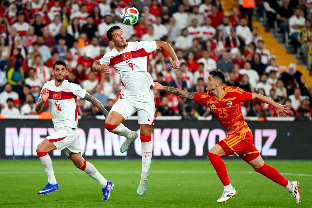  Deniz Gul vies with Jovan Manev during the international friendly football match between Turkey and North Macedonia. Photo by Yasin AKGUL / AFP via Getty Images