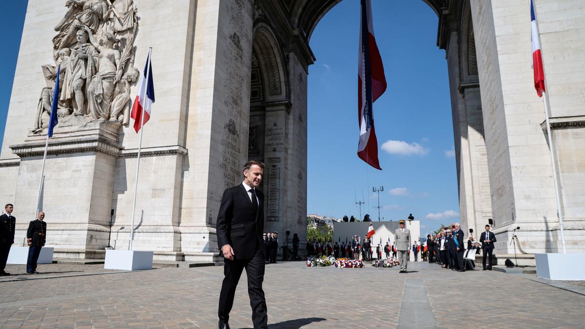 France's President Emmanuel Macron walks in front of the Arc de Triomphe for a ceremony marking the 81st anniversary of Victory in Europe Day, which commemorates the end of the Second World War in Europe, in Paris, France, May 8, 2026.     LUDOVIC MARIN/Pool via REUTERS