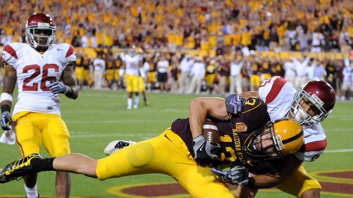  Nov 7, 2009; Tempe, AZ, USA; Arizona State Sun Devils receiver Chris McGaha (13) catches a 23-yard touchdown pass in the third quarter as Southern California Trojans cornerback Kevin Thomas (15) and safety Will Harris (26) defend at Sun Devil Stadium. USC defeated Arizona State 14-9. Mandatory Credit: Kirby Lee/Image of Sport-Imagn Images | Kirby Lee-Imagn Images 