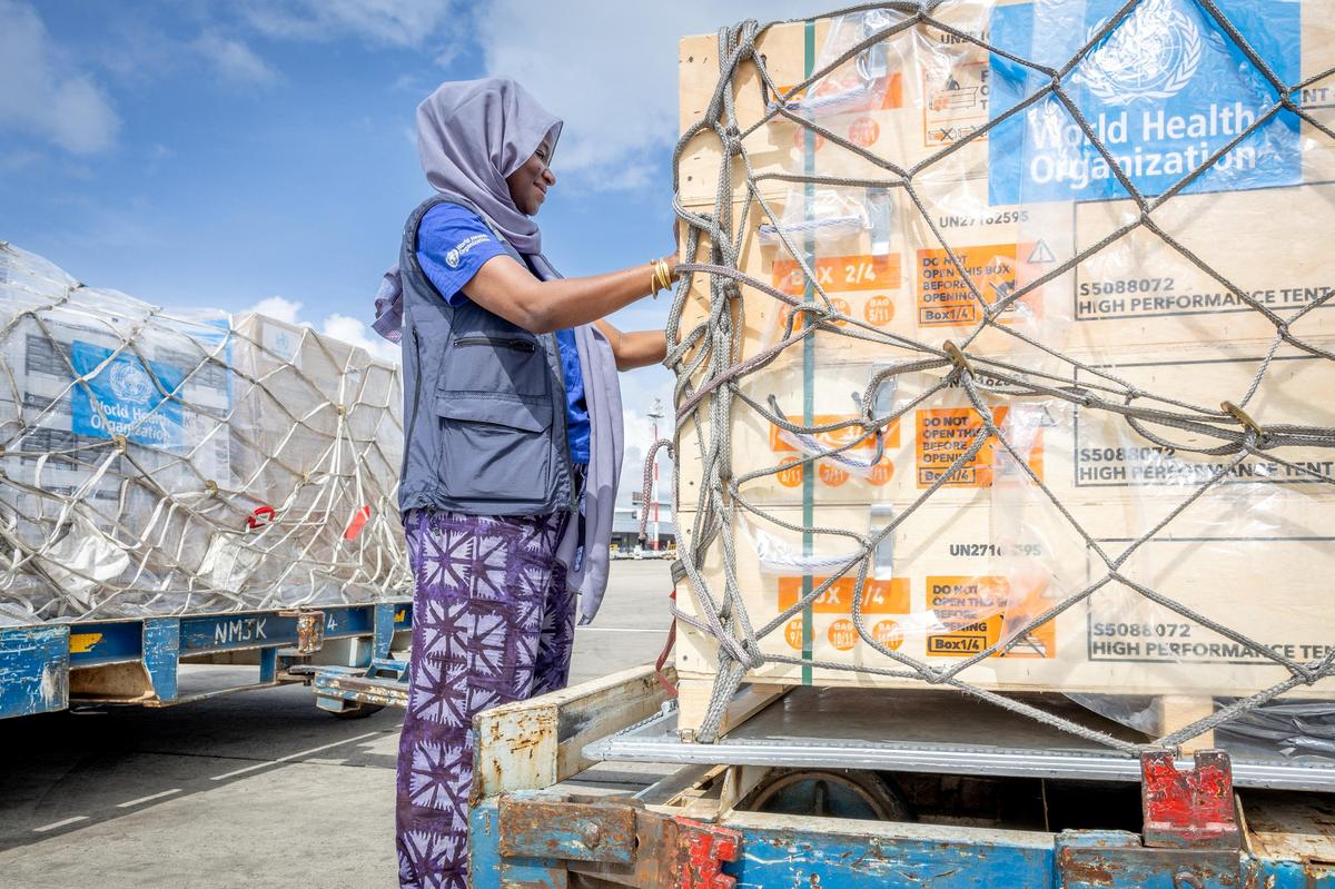 Fatima Tafida, the Regional Supply Chain Lead for Emergencies at the World Health Organization's (WHO) Regional Office for Africa pastes stickers on shipment pallets as the WHO mobilises 4.7 tonnes of essential medical supplies and emergency kits to support the affected regions in response to the Ebola outbreak in the Democratic Republic of Congo from the Jomo Kenyatta International Airport (JKIA) in Nairobi, Kenya May 18, 2026.