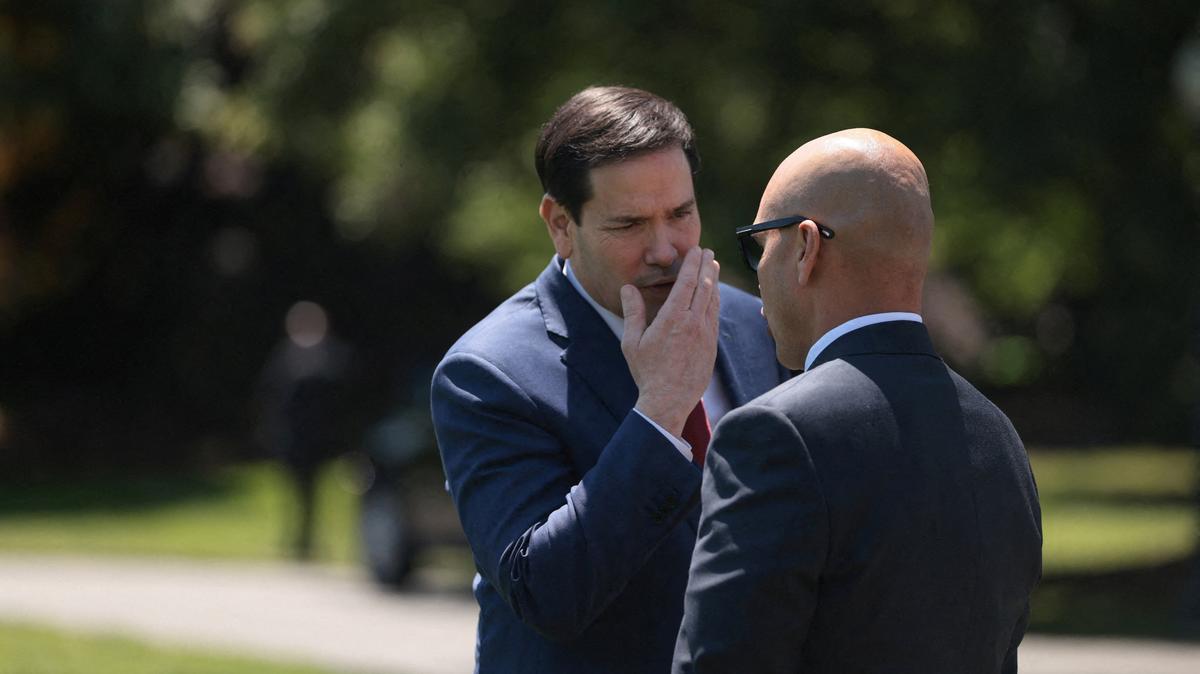 U.S. Secretary of State Marco Rubio talks with White House Director of Oval Office Operations Walt Nauta, ahead of U.S. President Donald Trump's departure from the White House for Joint Base Andrews en route to Beijing, China, in Washington, D.C., U.S., May 12, 2026. REUTERS/Evelyn Hockstein