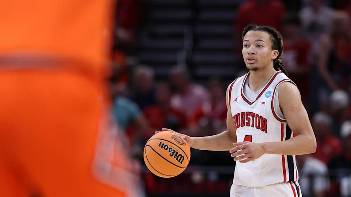  Mar 26, 2026; Houston, TX, USA; Houston Cougars guard Kingston Flemings (4) dribbles the ball against the Illinois Fighting Illini in the first half during a Sweet Sixteen game of the South Regional of the men's 2026 NCAA Tournament at Toyota Center. Mandatory Credit: Troy Taormina-Imagn Images | Troy Taormina-Imagn Images 
