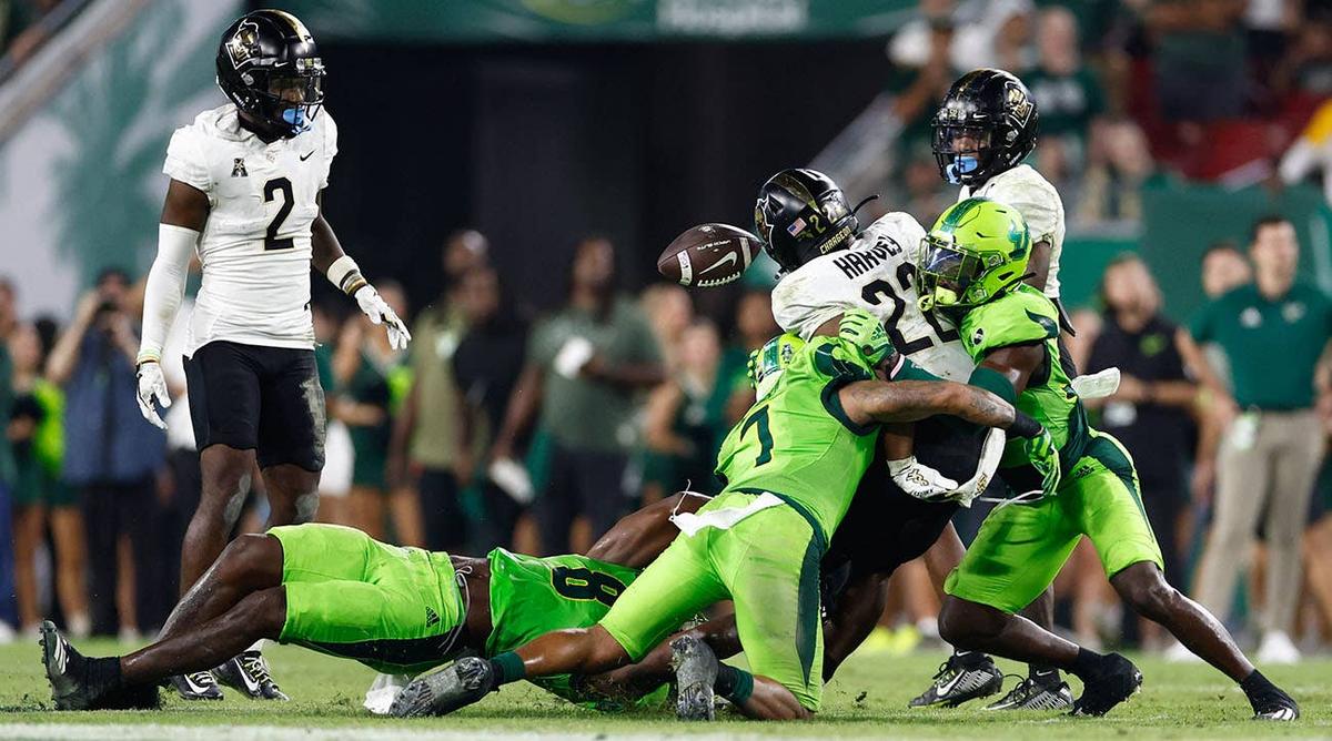  UCF Knights running back RJ Harvey fumbles the ball against the USF Bulls in Tampa, Florida, on Nov. 26, 2022. Douglas DeFelice-USA TODAY Sports
