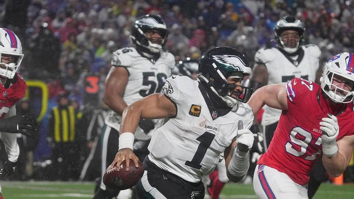  Philadelphia Eagles quarterback Jalen Hurts is chased down by several Bills players including Buffalo Bills defensive end Joey Bosa who forced Hurts to throw the ball away during second half action against the Philadelphia Eagles at Highmark Stadium in Orchard Park on Dec. 28, 2025. | Tina MacIntyre-Yee/Democrat and Chronicle / USA TODAY NETWORK via Imagn Images 