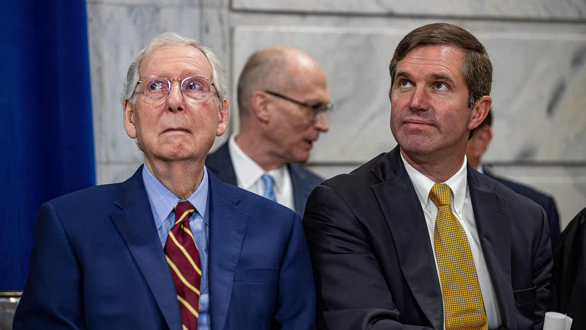 U.S. Sen. Mitch McConnell, left, and Gov. Andy Beshear sit in the Kentucky Capitol in January 2024 at the start of the legislative session. After Beshear has called on McConnell to be more transparent about his recent hospitalization.