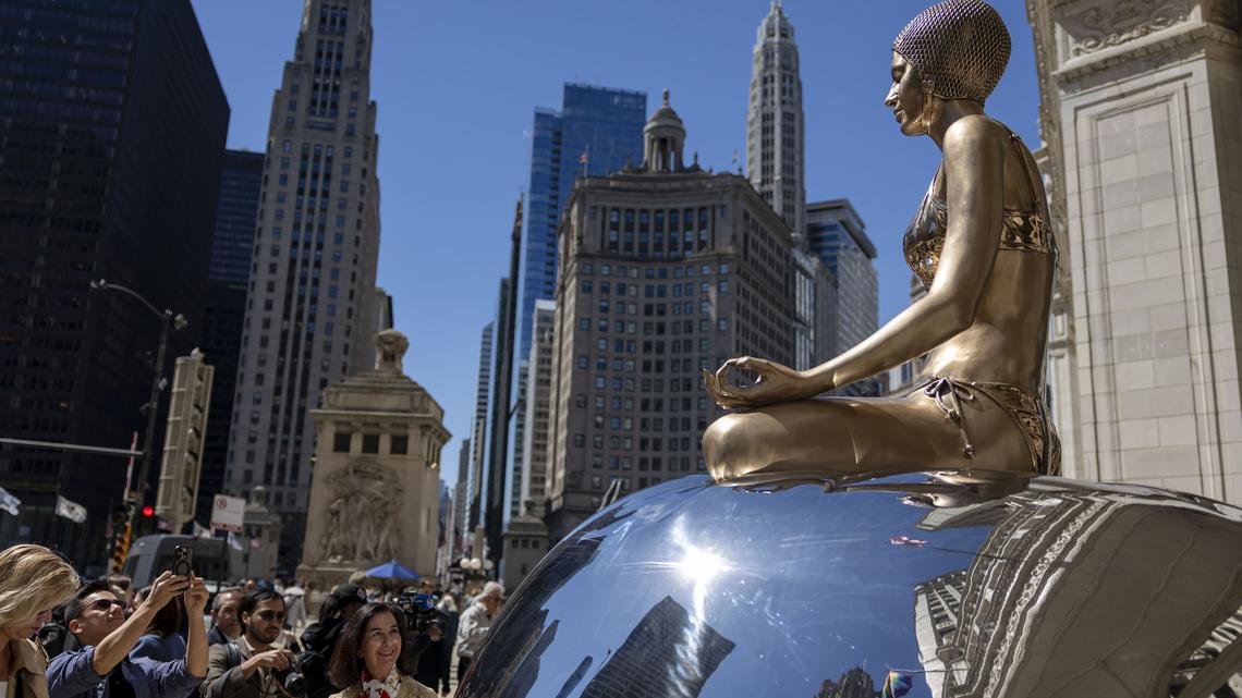 Swimmer sculptures arrive on Chicago's Michigan Avenue for the summer 