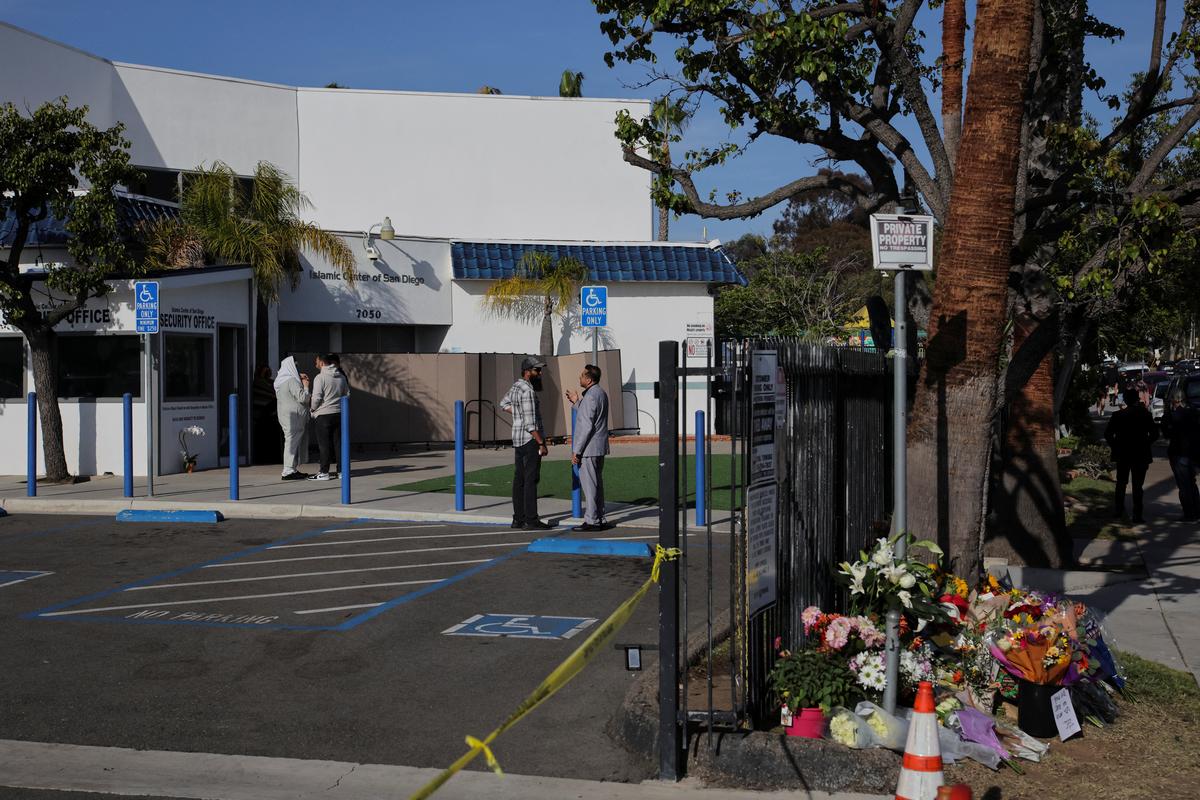Flowers lay outside the Islamic Centre of San Diego, the day after a shooting incident, in San Diego, California, U.S, May 19, 2026. REUTERS/Daniel Cole