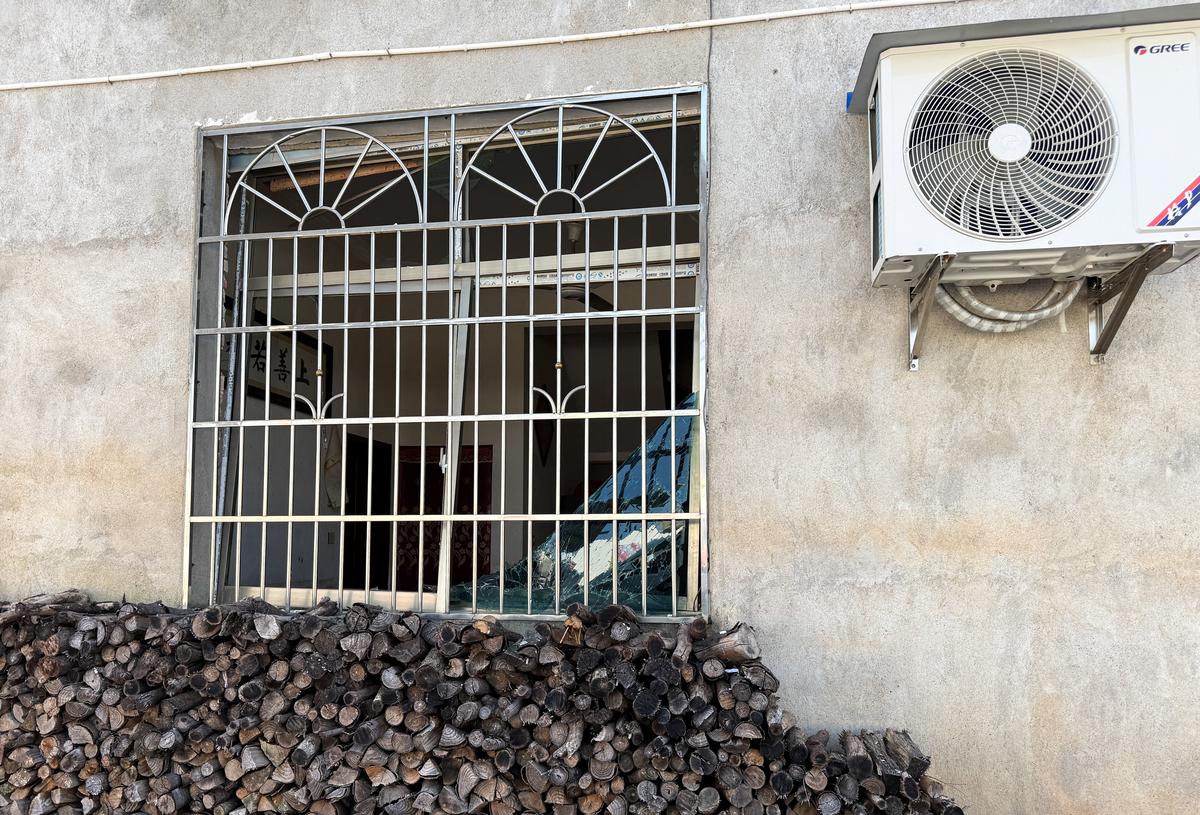 A damaged window of a building after a blast at a fireworks manufacturing factory in Liuyang, Hunan province, China, May 6, 2026. REUTERS/Maxim Shemetov