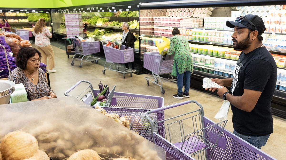 Customers shop for produce at Pioneer Cash and Carry in Little India in Artesia, California, on Friday, Aug. 1, 2025. Store owner Devraj Keray said the business will have to raise prices on imported Indian products due to tariffs. “We’ll have to pass that on to the consumer,” he said. “There’s not really any way around that.”