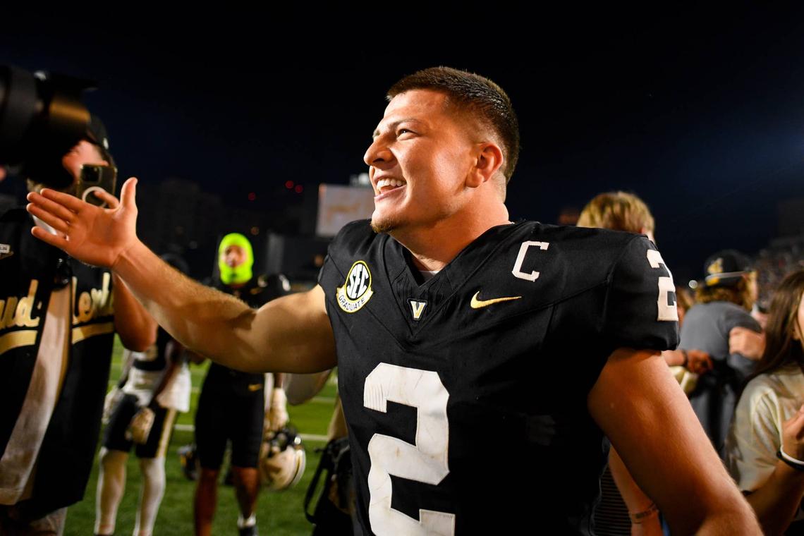  Nov 8, 2025; Nashville, Tennessee, USA; Vanderbilt Commodores quarterback Diego Pavia (2) celebrates the win against the Auburn Tigers during the overtime period at FirstBank Stadium. Mandatory Credit: Steve Roberts-Imagn Images 
