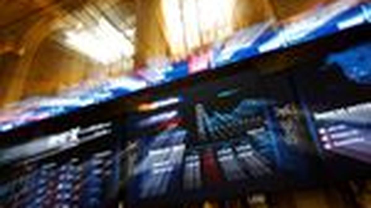 FILE PHOTO: Electronic boards display stock information at the stock exchange in Madrid, Spain, April 7, 2025. Photo taken with slow shutter speed and zoom lens. REUTERS/Susana Vera/File Photo