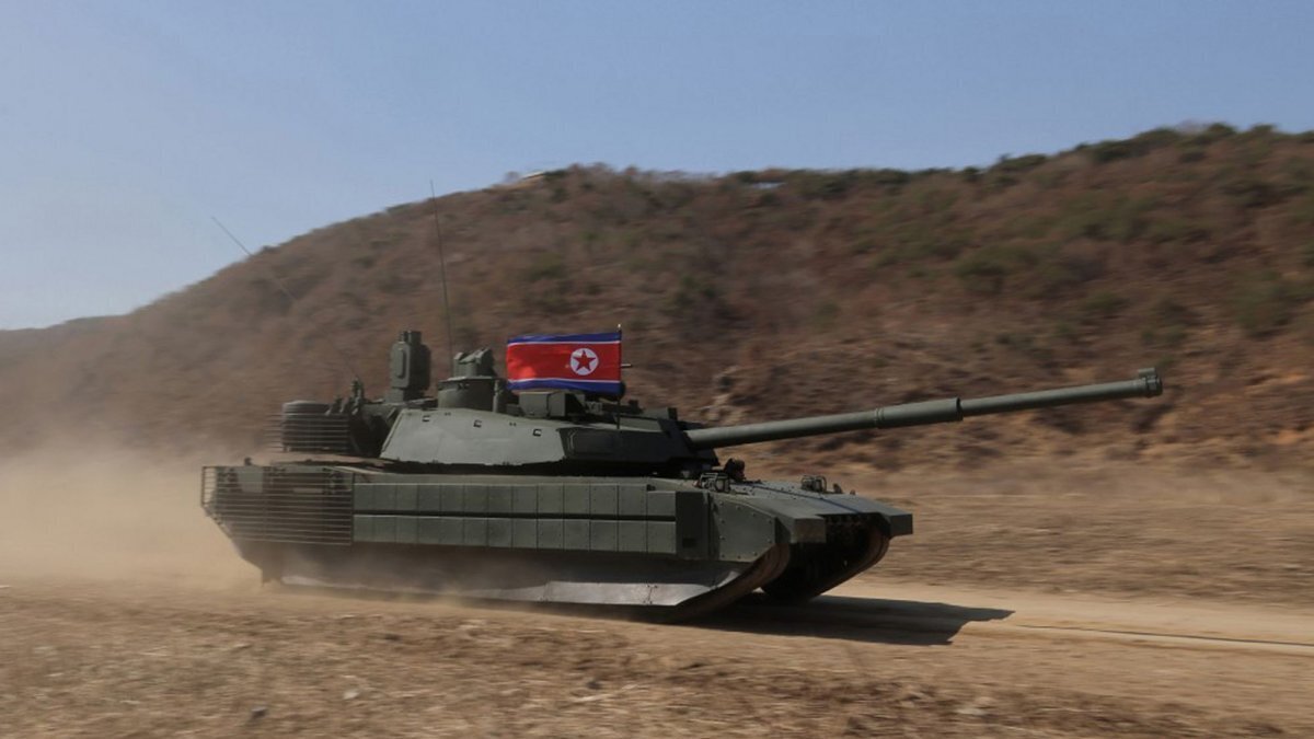This image, released on March 20 by the North Korean Official News Service (KCNA), shows North Korean leader Kim Jong Un and his daughter, Kim Ju Ae, observing a military exercise involving tanks, drones and other munitions. The North Korean leader enjoyed a ride on a tank while his daughter appeared to be driving it.