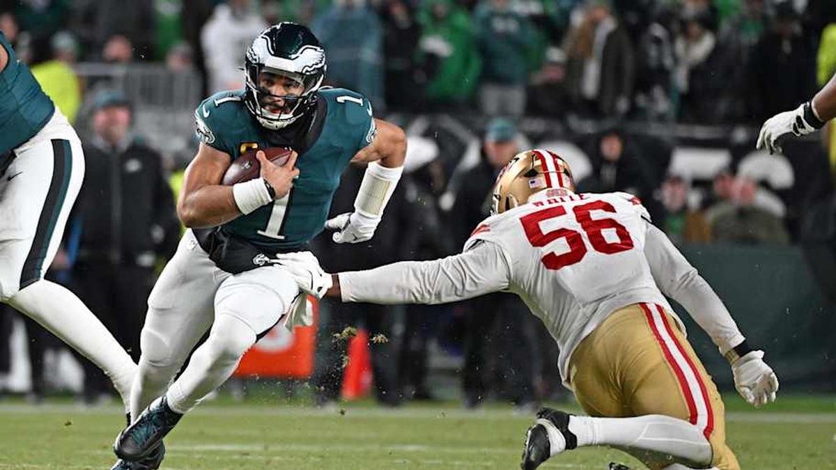  Jan 11, 2026; Philadelphia, PA, USA; Philadelphia Eagles quarterback Jalen Hurts (1) runs past San Francisco 49ers defensive end Keion White (56) in an NFC Wild Card Round game at Lincoln Financial Field. Mandatory Credit: Eric Hartline-Imagn Images | Eric Hartline-Imagn Images 