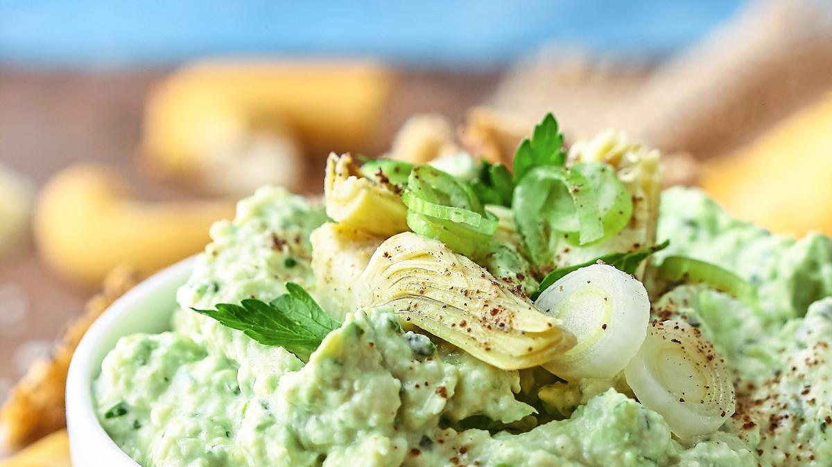 Homemade Artichoke Dip with crackers.