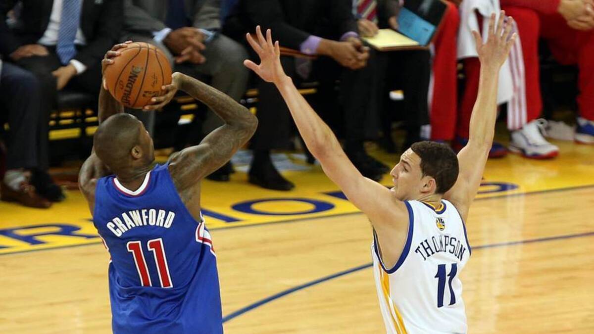  Apr 27, 2014; Oakland, CA, USA; Los Angeles Clippers guard Jamal Crawford (11) scores a three-point basket against Golden State Warriors guard Klay Thompson (11) during the second quarter of game four of the first round of the 2014 NBA Playoffs at Oracle Arena. Mandatory Credit: Kelley L Cox-Imagn Images | Kelley L Cox-Imagn Images 