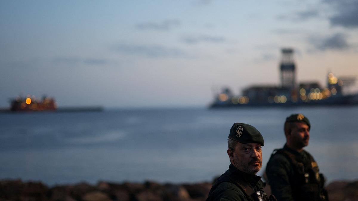 Members of the Spanish Civil Guard stand guard at the port of Granadilla de Abona, where the cruise ship MV Hondius is expected to dock after being affected by a hantavirus outbreak, in Tenerife, Spain, May 9, 2026. REUTERS/Hannah McKay