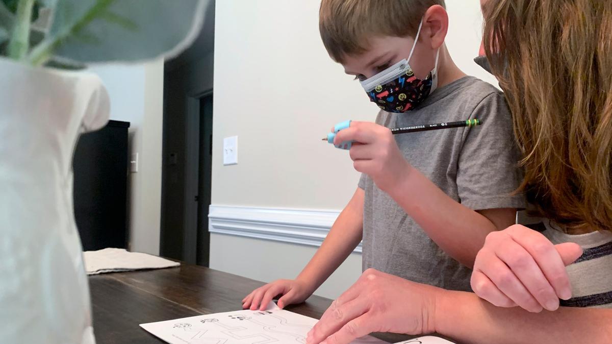 School districts across the country have been easing mask restrictions. For now in Johnson County younger students must wear them.