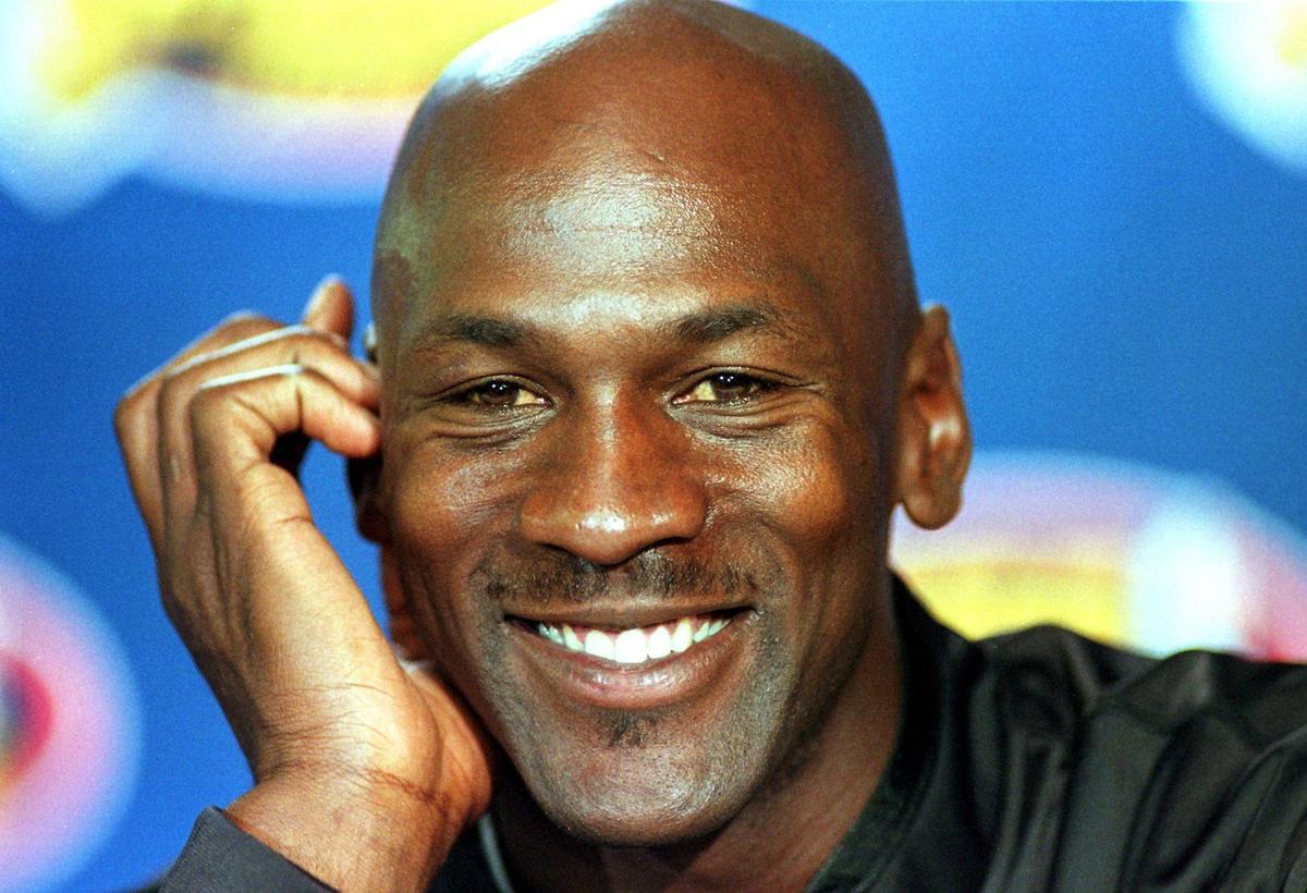  Chicago Bulls star Michael Jordan answers questions during a press conference at the United Center during the 1998 NBA Finals. DANIEL LIPPITT/AFP via Getty Images