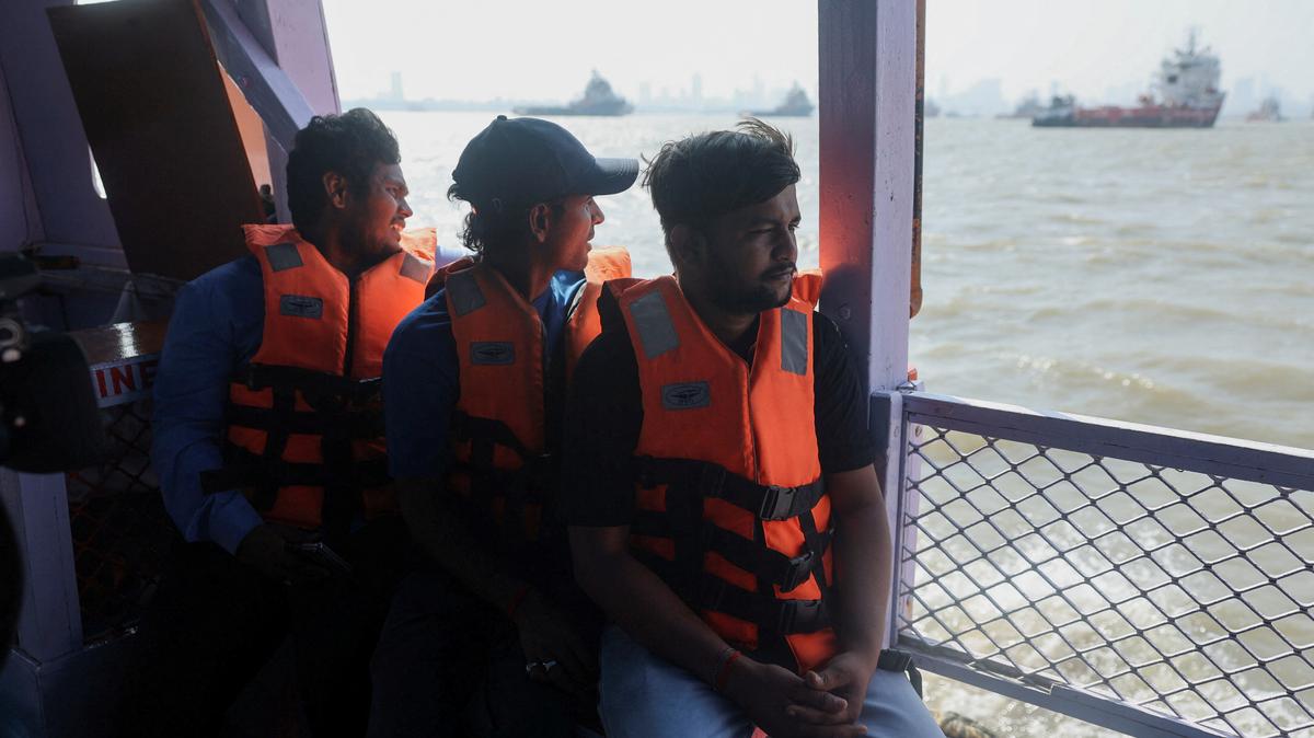Anant Singh Chauhan and Tithi Chiranjeevi, Indian seafarers who were stuck in Iran during the conflict travel on a ferry in Mumbai, India, May 6, 2026. REUTERS/Francis Mascarenhas