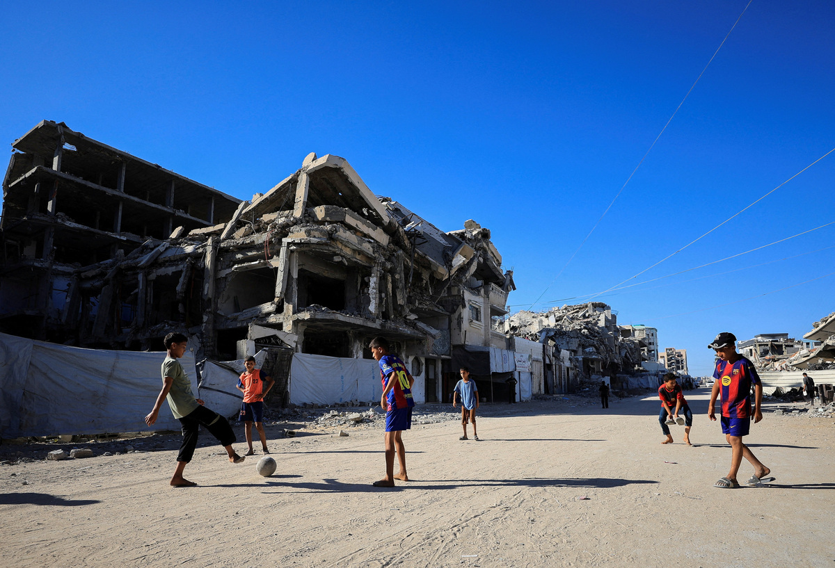 Palestinian children play soccer on a street in Gaza City, June 13, 2026. REUTERS/Dawoud Abu Alkas
