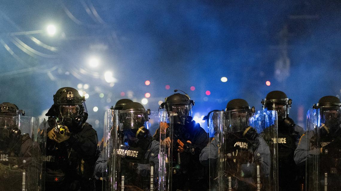 New Jersey state police assert control outside migrant detention center 
