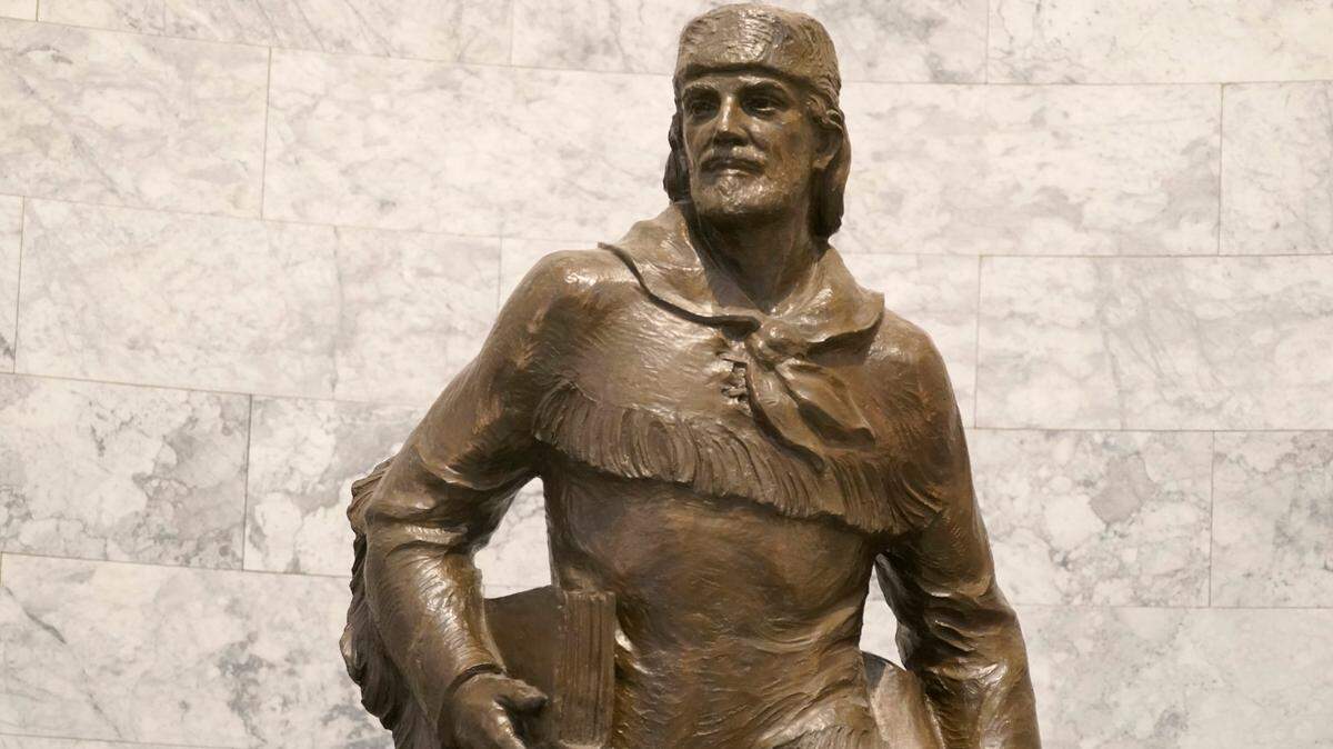 A statue of Marcus Whitman is displayed in the Legislative Building at the Capitol in Olympia, Wash., Wednesday, May 12, 2021. For generations, Whitman has been viewed as an iconic figure from early Pacific Northwest history, a venerated Protestant missionary who was among 13 people killed by the Cayuse tribe near modern-day Walla Walla, Washington, in 1847. But this past year has seen the continued reappraisal of Whitman, whose actions are now viewed by many as imperialistic and destructive, and the Washington Legislature voted to remove a similar statue of Whitman from Statuary Hall in Washington, D.C. (AP Photo/Ted S. Warren)