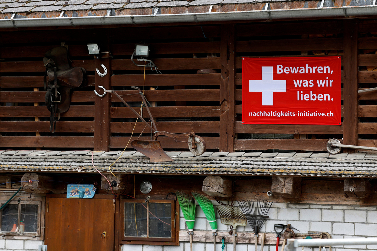 A sign is pictured ahead of a June 14 vote on a plan backed by the right-wing Swiss People's Party (SVP) to cap the population at 10 million inhabitants, in Glarus, Switzerland, May 18, 2026. The sign reads: "Preserve what we love". REUTERS/Stefan Wermuth