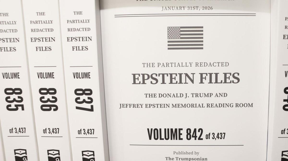 Book Volumes of the partially redacted Epstein files. Surrey, England, police said they are investigating old cases related to the release of the Epstein files.