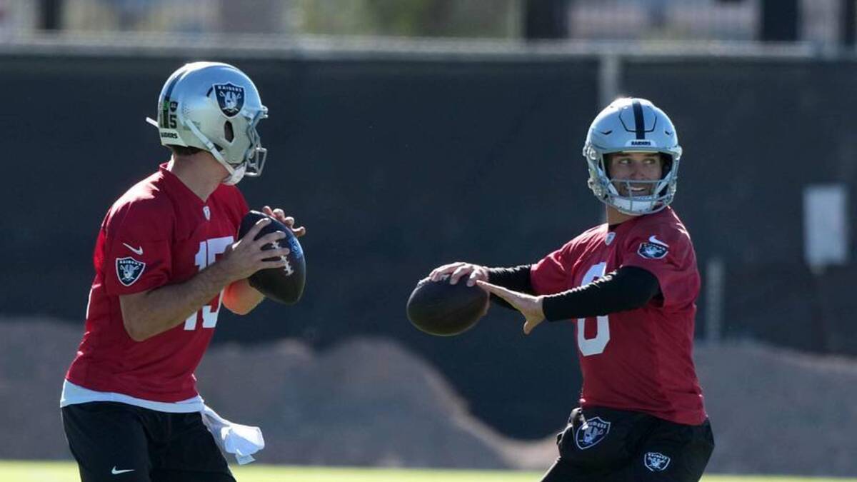  Jun 9, 2026; Henderson, NV, USA; Las Vegas Raiders quarterbacks Fernando Mendoza (15) and Kirk Cousins (8) throw the ball as assistant head coach Mike McCoy (left) watches during organized team activities at Intermountain Health Performance Center. Mandatory Credit: Kirby Lee-Imagn Images | Kirby Lee-Imagn Images 