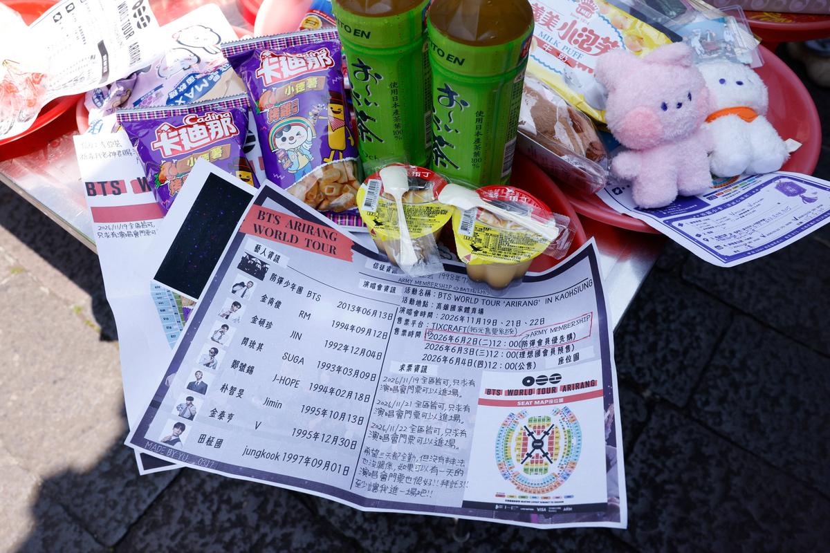 Offerings of snacks with BTS merchandise, concert seat maps and wish lists are seen on an altar table for Yue Lao, the god of love in Chinese mythology who oversees relationships and marriage, at Taipei’s Bangka Lungshan Temple, in hopes of securing a concert ticket, in Taipei, Taiwan, May 30, 2026. REUTERS/Ann Wang