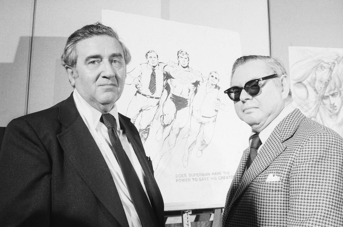 Superman creators Jerry Siegel and Joe Shuster pose in front of sketches of their creation.Bettmann Archives/Getty Images