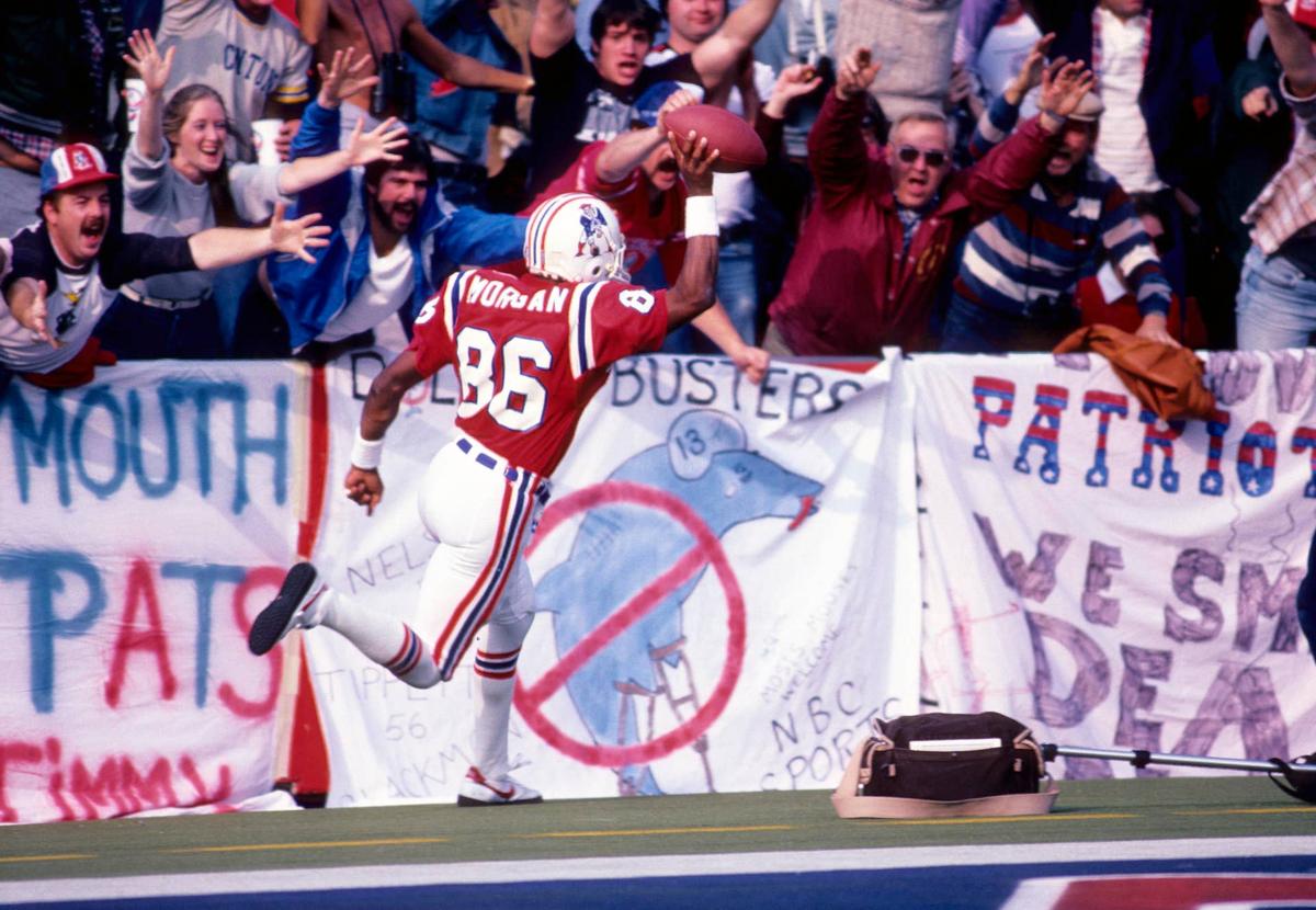  New England Patriots receiver Stanley Morgan scores a touchdown against the Miami Dolphins at Foxboro Stadium. Dick Raphael-USA TODAY Sports