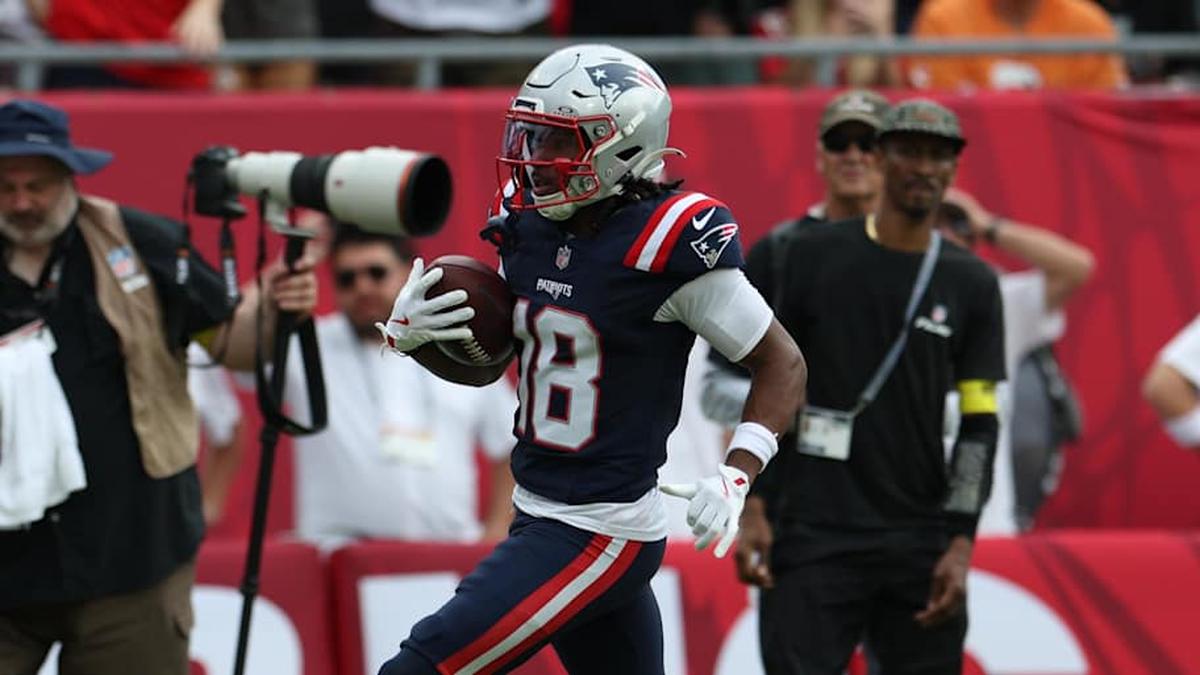  Nov 9, 2025; Tampa, Florida, USA; New England Patriots wide receiver Kyle Williams (18) runs for a touchdown during the second quarter against the Tampa Bay Buccaneers at Raymond James Stadium. Mandatory Credit: Nathan Ray Seebeck-Imagn Images | Nathan Ray Seebeck-Imagn Images 