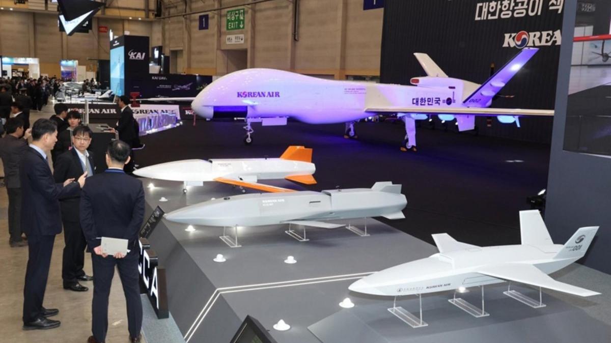 Visitors look at artificial intelligence-based unmanned aerial vehicles at the booth of Korean Air Co. during Drone Show Korea, the biggest drone exhibition in Asia, at the BEXCO convention center in Busan, South Korea. Photo by YONHAP / EPA