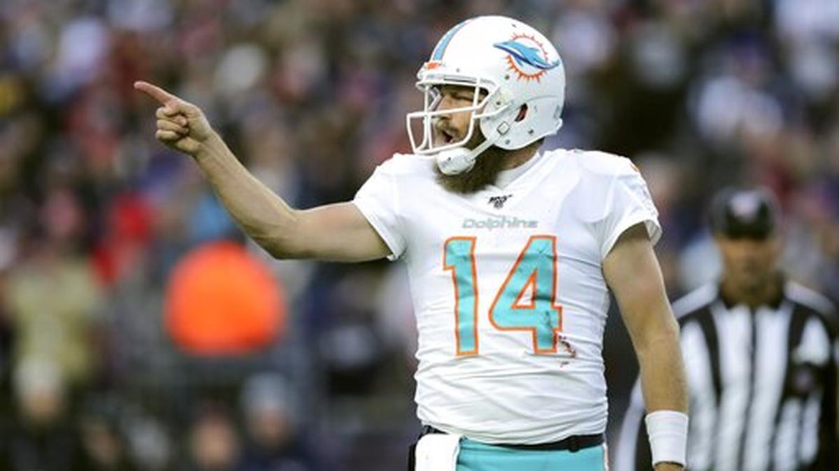 Miami Dolphins quarterback Ryan Fitzpatrick celebrates his winning touchdown pass to Mike Gesicki in the second half of an NFL football game against the New England Patriots, Sunday, Dec. 29, 2019, in Foxborough, Mass.