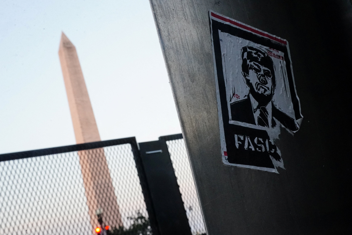 A sticker depicting U.S. President Donald Trump, next to security barricades near the Washington Monument ahead of Fourth of July celebrations, marking the 250th anniversary of U.S. Independence, in Washington, D.C., U.S., July 4, 2026. REUTERS/Nathan Howard