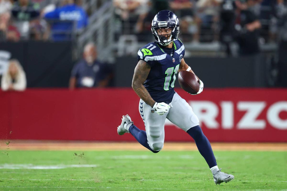  Seattle Seahawks wide receiver Jaxon Smith-Njigba runs against the Arizona Cardinals at State Farm Stadium. Mark J. Rebilas-Imagn Images