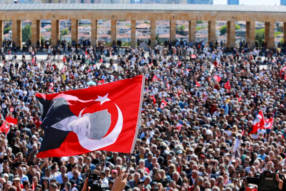 A person waves a flag of Turkey featuring a picture of modern Turkey’s founder Mustafa Kemal Ataturk as supporters of Ozgur Ozel, the ousted chairman of the main opposition Republican People’s Party (CHP), visit the mausoleum of Mustafa Kemal Ataturk in Ankara, Turkey, May 30, 2026. REUTERS/Efekan Akyuz