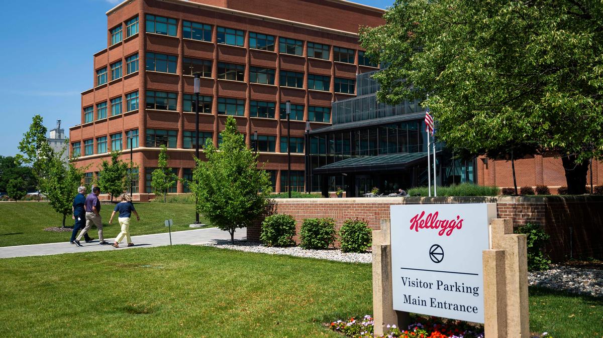 Pedestrians walk towards the W.K. Kellogg Co. and Kellanova headquarters on Thursday, July 10, 2025, in Battle Creek, Michigan. (Katy Kildee/The Detroit News/TNS)