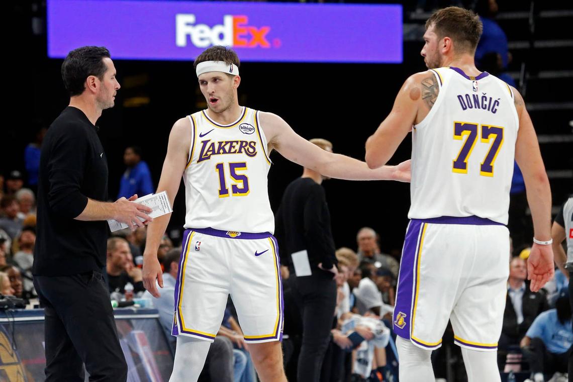  Lakers head coach JJ Redick talks with guard Austin Reaves (15) and guard Luka Doncic Petre Thomas-Imagn Images