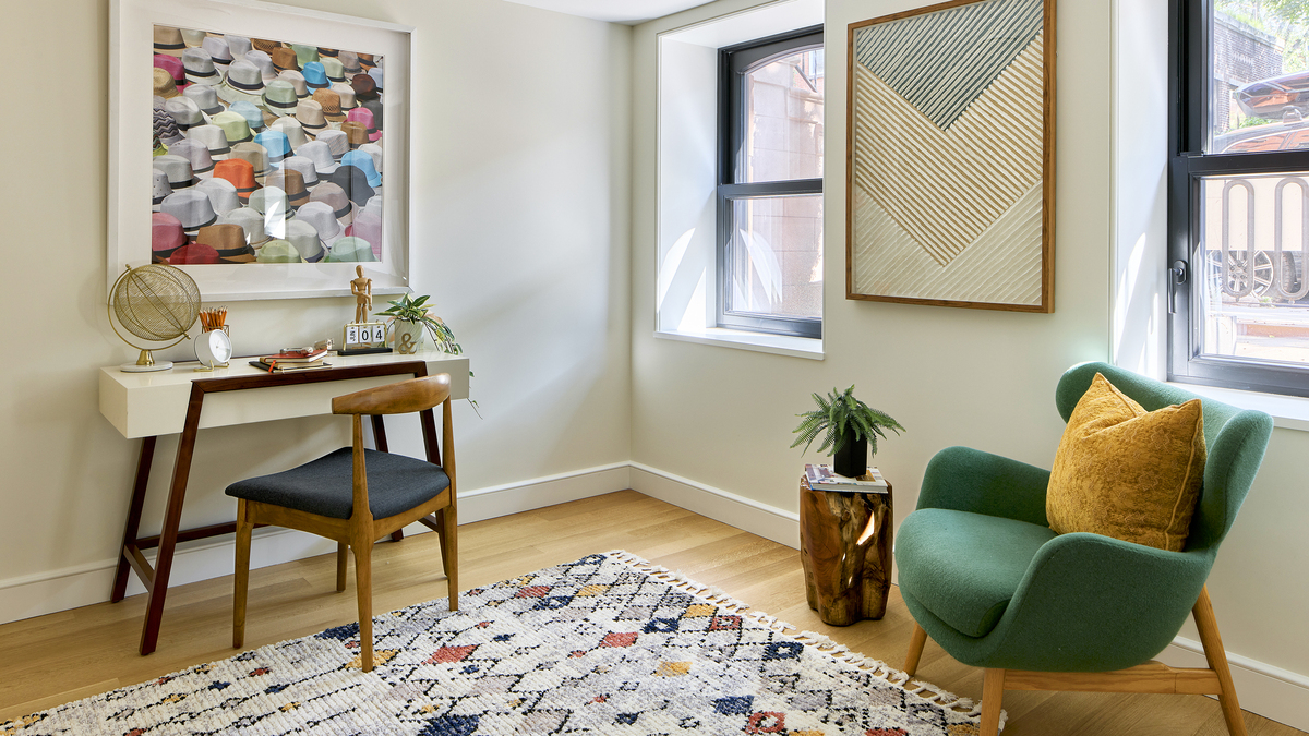 A variation of Hans Wegner’s elbow chair makes a classic statement in this home office.  (Handout/TNS)
