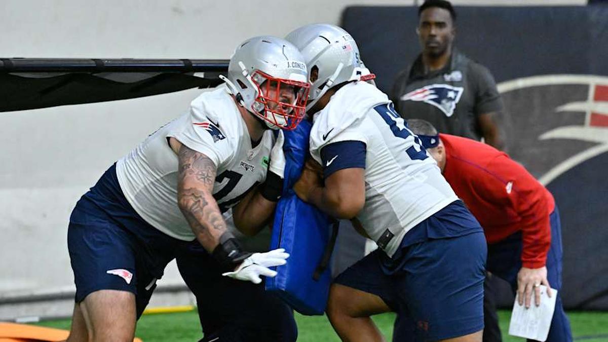  May 9, 2025; Foxborough, MA, USA; New England Patriots guard Jack Conley works with center tryout Tuli Teuhema (59) during rookie camp at Gillette Stadium. Mandatory Credit: Eric Canha-Imagn Images | Eric Canha-Imagn Images 